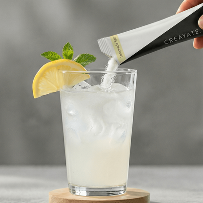 Mixing CREAYATE creatine electrolyte sachet with water to make lemonade salt drink